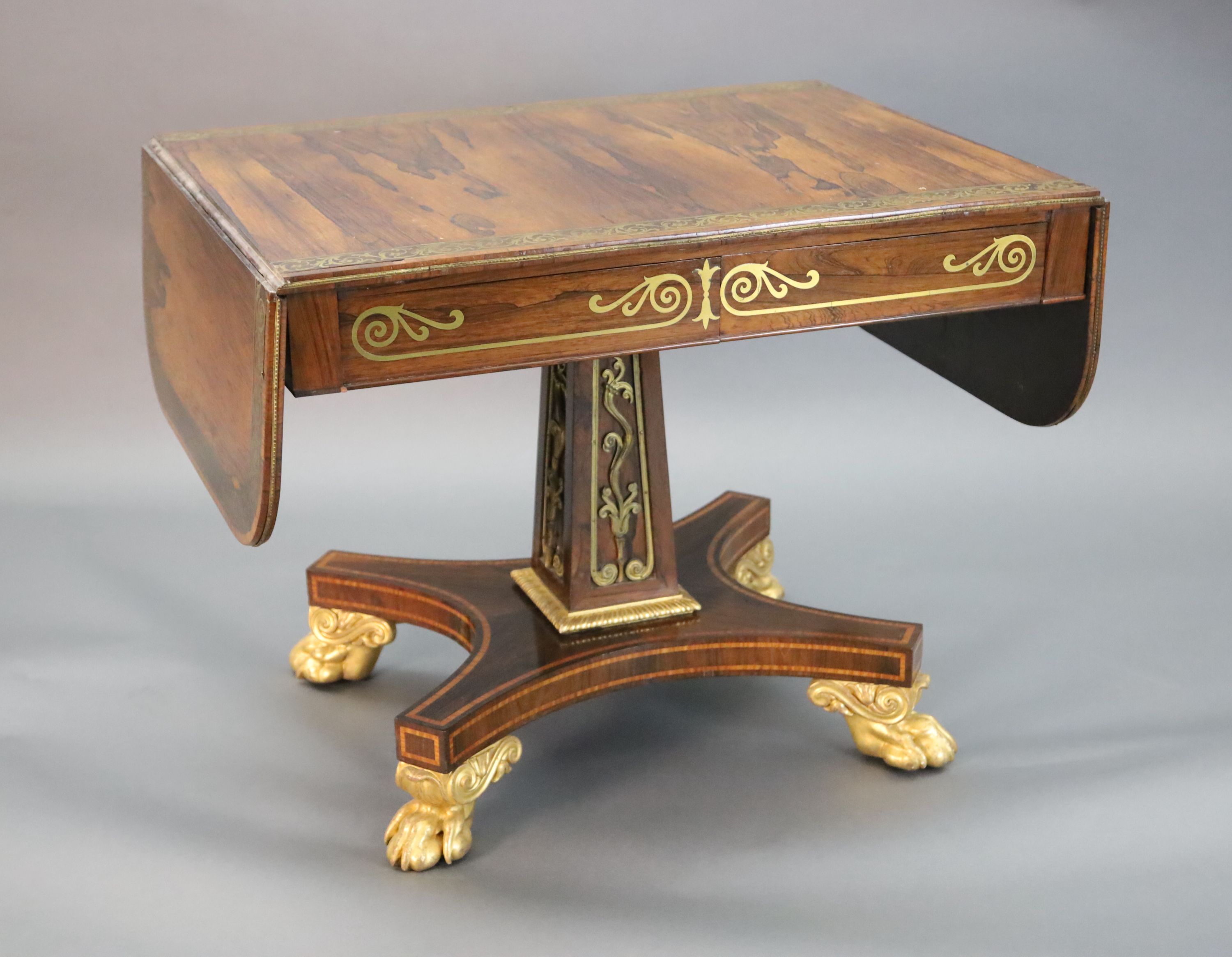 A Regency brass inset rosewood sofa table, W.3ft 2in. D.2ft 3in. opens out to 4ft 11in. H.2ft 4in.